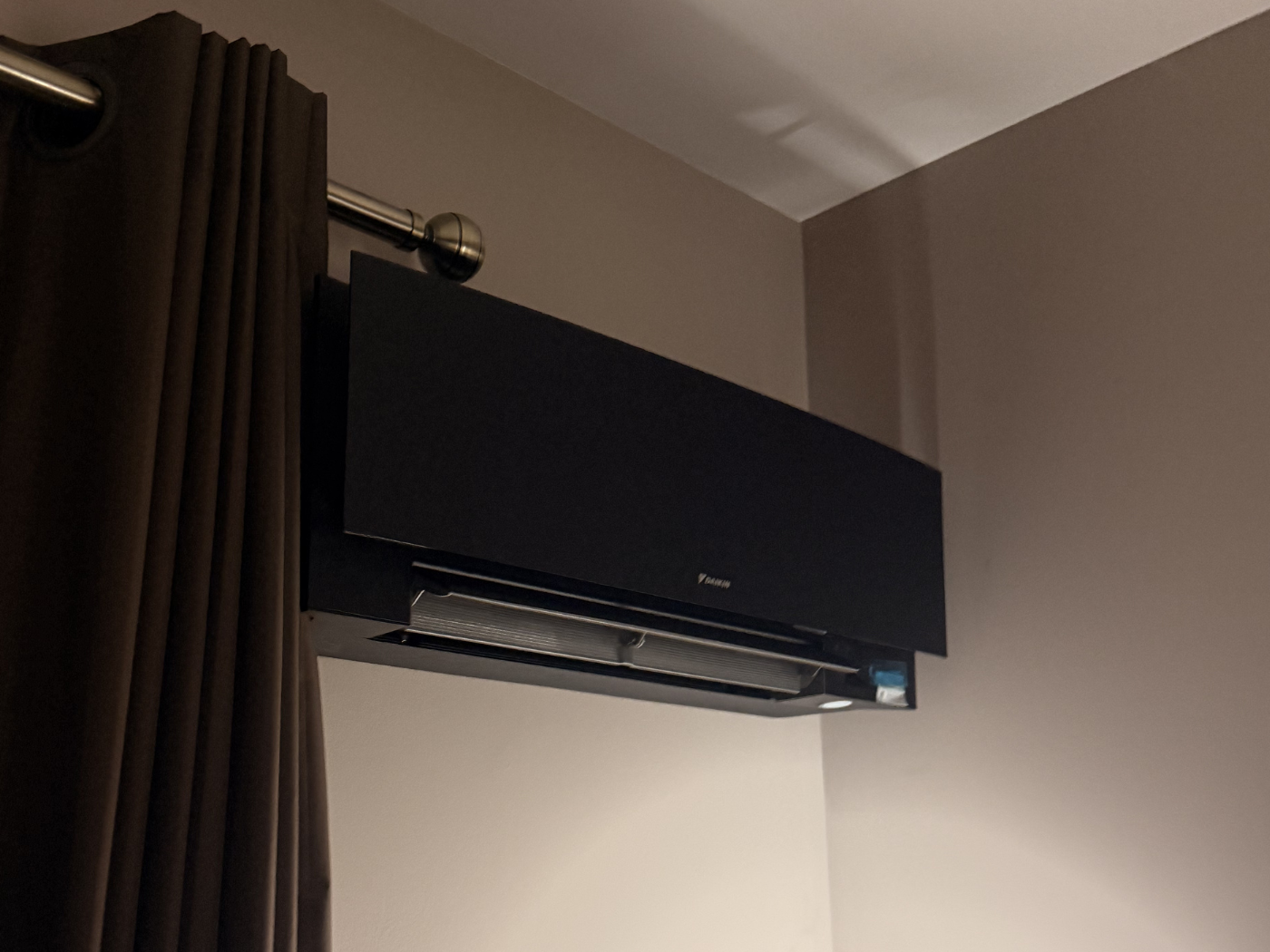 Black Daikin indoor air conditioning unit installed by Novaclima